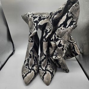 Jessica Simpson snakeskin loom high heel boots
